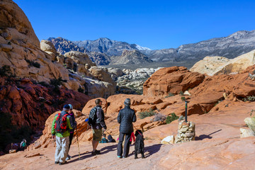 tourists visitors backpackers in red rock mountains landscape Red Rock Canyon National Conservation...