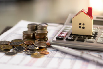 planning savings money of coins to buy a home concept for property