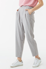 young girl in grey trousers