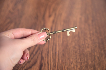woman hand key  on table