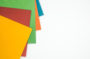 Sheets of colored paper on white background