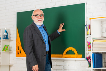 STEM subjects are basis for technology. become good at math. stem in classroom. senior man teacher...