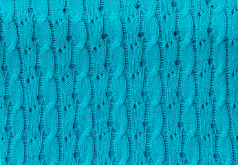 hand-knitted fabric in blue color, for background, screensaver, abstraction
