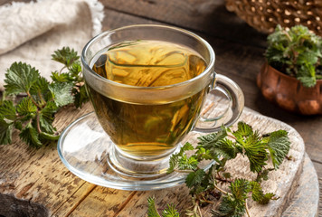 Stinging nettle tea in a glass cup