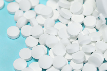 White pills close up. Health care theme concept.