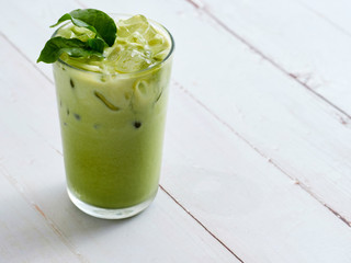 Iced Matcha Latte Tea with leaves.