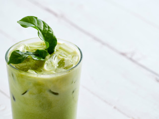 Iced Matcha Latte Tea with leaves.