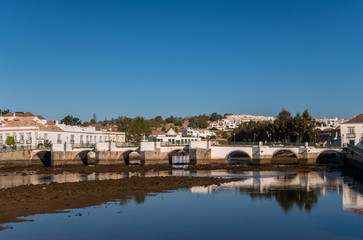Fototapeta na wymiar Roman Bridge over the River Gilao in Tavira, Eastern Algarve, Portugal