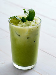 Iced Matcha Latte Tea with leaves.