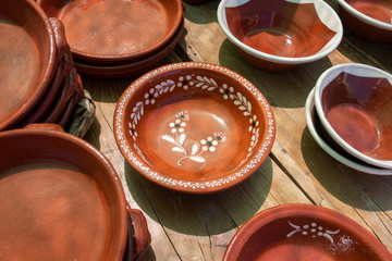 Various glazed dishes in market in the Algarve, Portugal