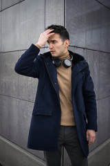 Obraz premium man guy walk headphones coat fashion style city