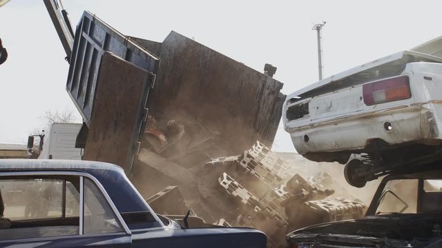 The dump truck full of scrap metal