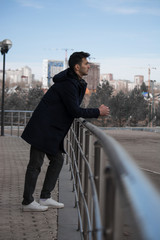 man guy walk headphones coat fashion style city