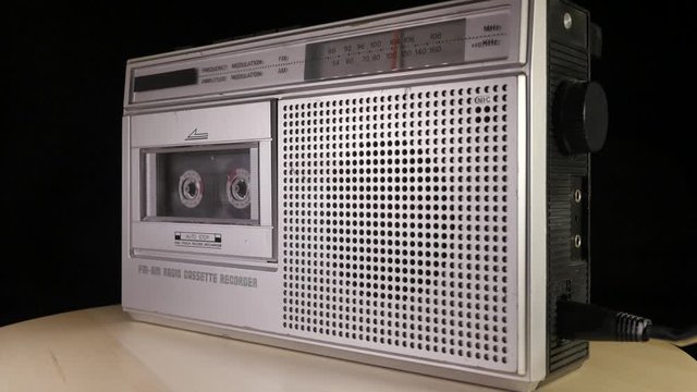 Cassette Radio Recorder rotating and playing music