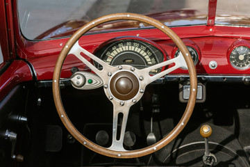 Classic 1951 Simca 8 Sport convertible car looking at dashboard and steering wheel from the drivers...