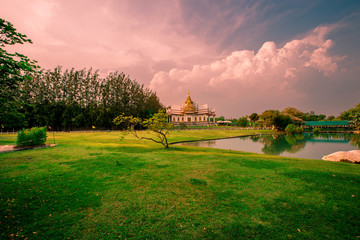 Naklejka premium Wallpaper Wat Lan Boon Mahawihan Somdet Phra Buddhacharn(Wat Non Kum)is the beauty of the church that reflects the surface of the water, popular tourists come to make merit and take a public photo