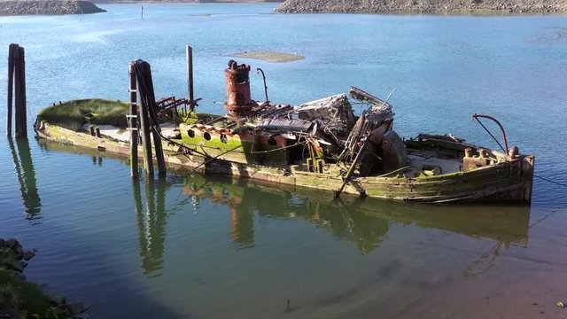 A steamer build in 1881 in Gold Beach now resting in peace in the Rouge River where it sank in 1985 now an important piece of culture and history and a valuable landmark in Gold Beach, Oregon 