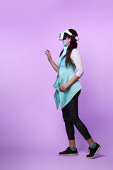 Woman is using virtual reality headset.