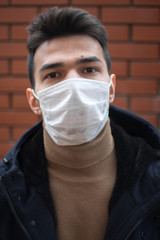 boy male man glance look eyes medical mask health protection coronovirus covid-19 brick