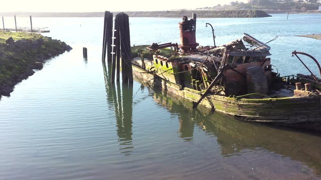 A steamer build in 1881 in Gold Beach now resting in peace in the Rouge River where it sank in 1985 now an important piece of culture and history and a valuable landmark in Gold Beach, Oregon 