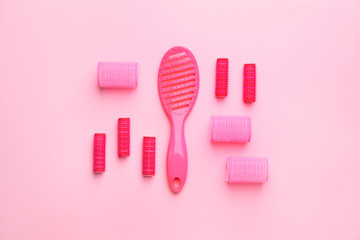 Set of hairdresser's accessories on color background