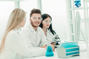 Fototapeta premium close up.a team of scientists use a computer to check the data