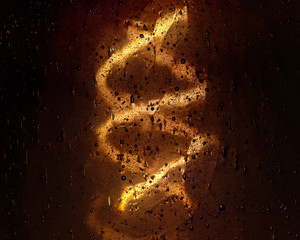 Light seen through a piece of glass with bubbles in it focus is on the glass bubbles.