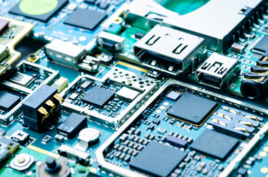 Electronic boards close-up with chips and electronic components, abstract
