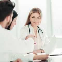 handshake of medical colleagues at the Desk in the office