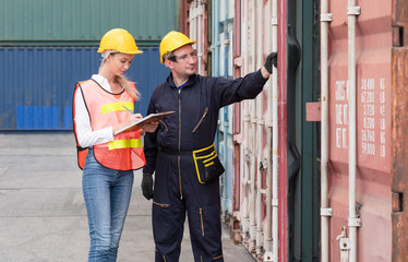Warehouse logistic staffs opening Containers box door checking products from .Cargo freight ship at Cargo container shipping