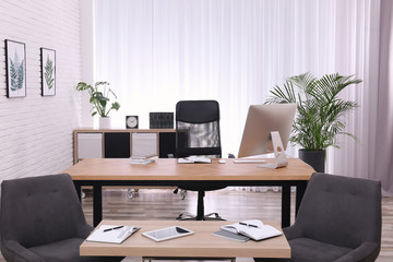 Director's office with large wooden table. Interior design