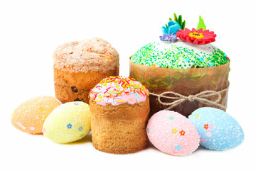 Three Easter cakes with colored eggs