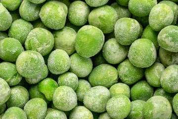closeup background and texture of frozen green peas