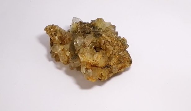 Specimen of Quartz stone on white background. Quartz is a mineral composed of silicon and oxygen atoms in a continuous framework of silicon oxygen tetrahedra. rock crystal