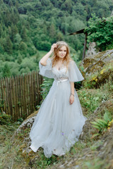 Fototapeta na wymiar Portrait of a bride in the mountains.