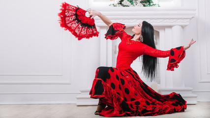 beautiful flamenco dancers performing a fiery dance - obrazy, fototapety, plakaty