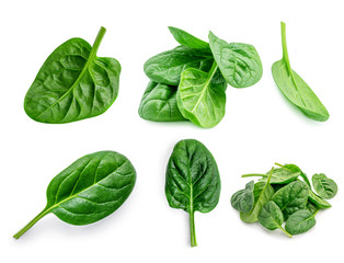 Spinach. Creative layout made of  Spinach leaves   isolated on white background.  Top view. Flat...