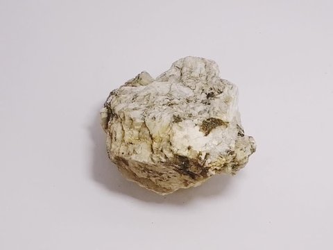 specimen of muscovite biotite granite stone on white background. mineral stone.