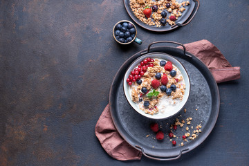 Tasty Strawberry Dessert, Homemade Yogurt with Strawberries, Granola and blueberries, raspberries and red currants. Seeds, Healthy Breakfast, Parfait in a Jar over Bright Background