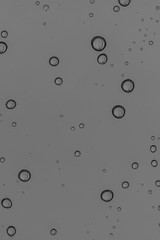 Rain water drops  on clear window.  Natural Pattern of raindrops. Autumn  depressive background..