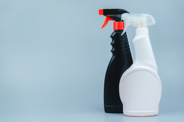 A set of cleaning and disinfection products on a gray background. Close-up with space for text....