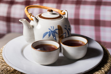 Obraz na płótnie Canvas two cup of tea on wooden table