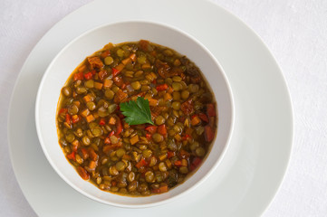 red lentil stew decorated with parsley leaf