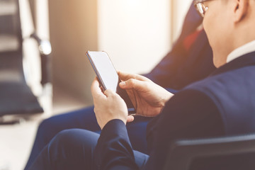 Close up of a man using mobile smart phone