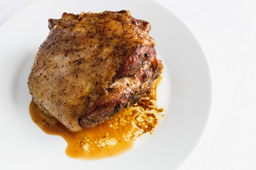 a plate with roasted in spices mutton 