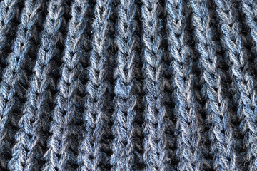 Crochet pattern, a close-up of a simple blue knitting pattern for background