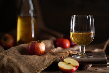 Apple cider on the wooden background
