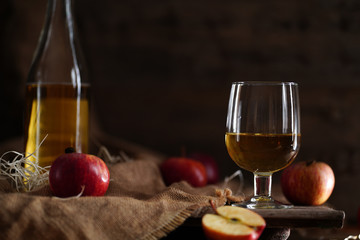 Apple cider on the wooden background