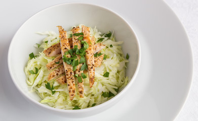 white cabbage salad with chicken and parsley