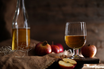 Apple cider on the wooden background